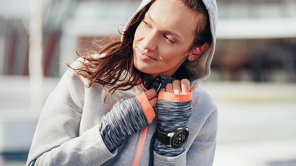 a woman outside with her Galaxy Watch