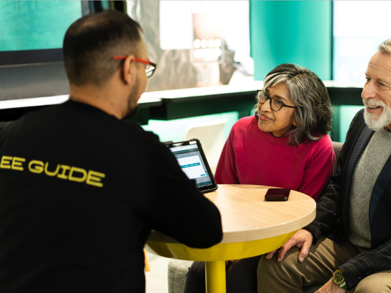 Old couple in an EE store being support by an EE employee