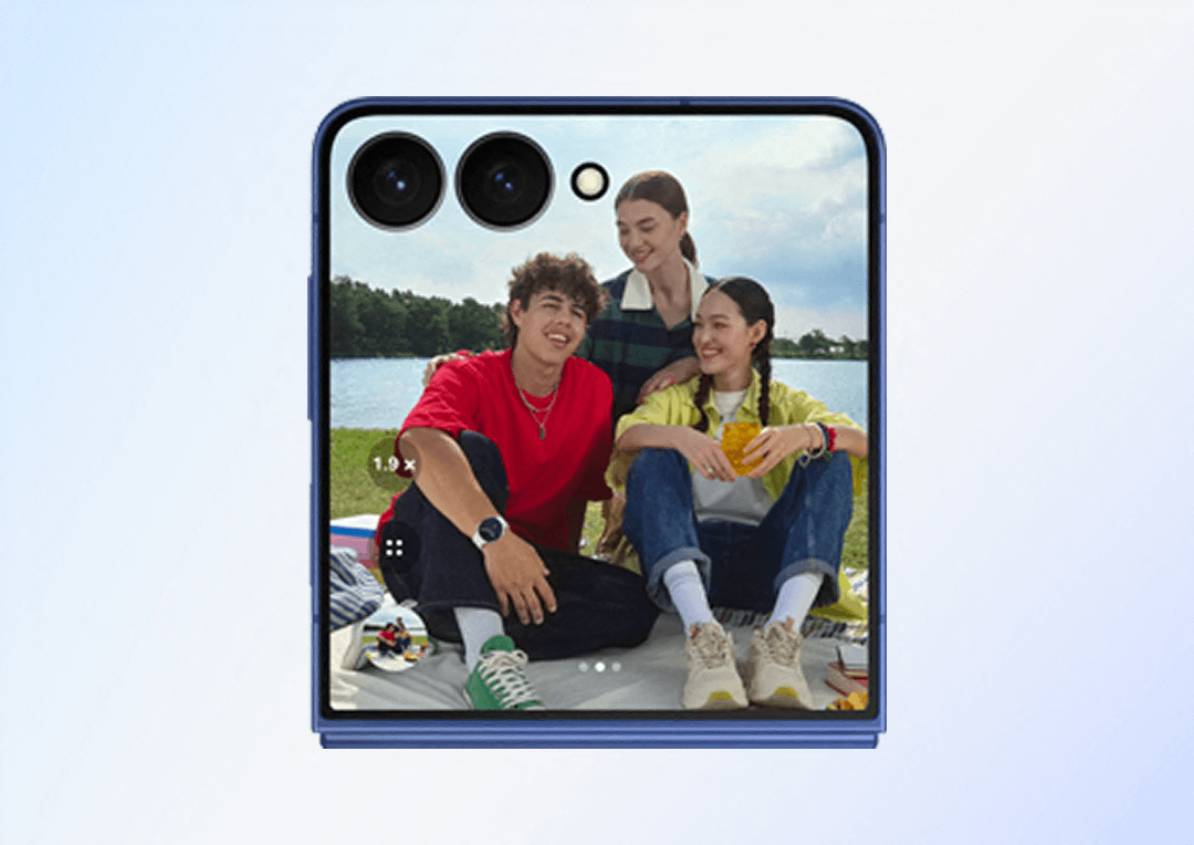 A group of 3 friends having a picnic and taking a selfie