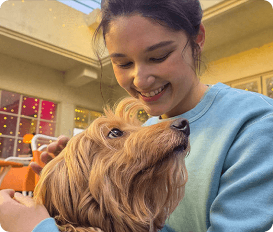 An image of a women with a dog