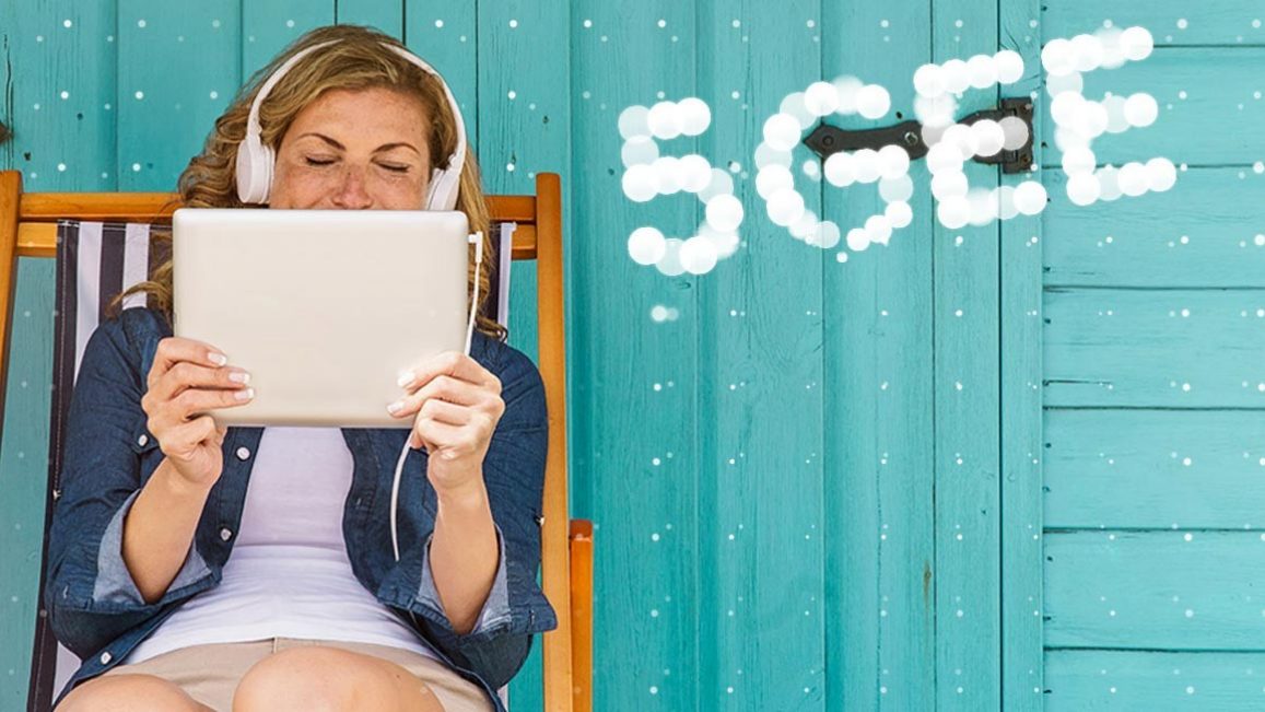 Woman streaming on a tablet using 5G on EE