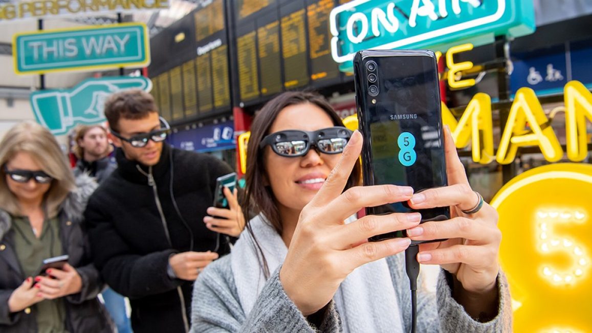 Woman taking a selfie with a 5G device