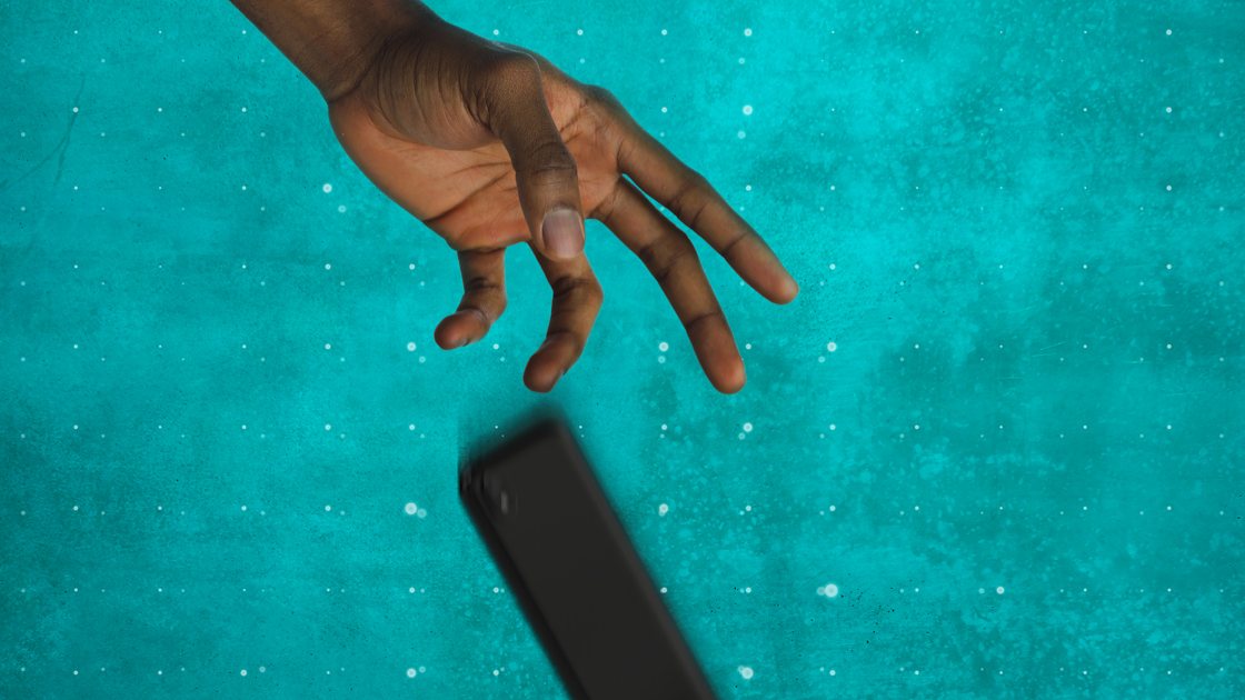 Mobile phone with damaged screen splashed with paint