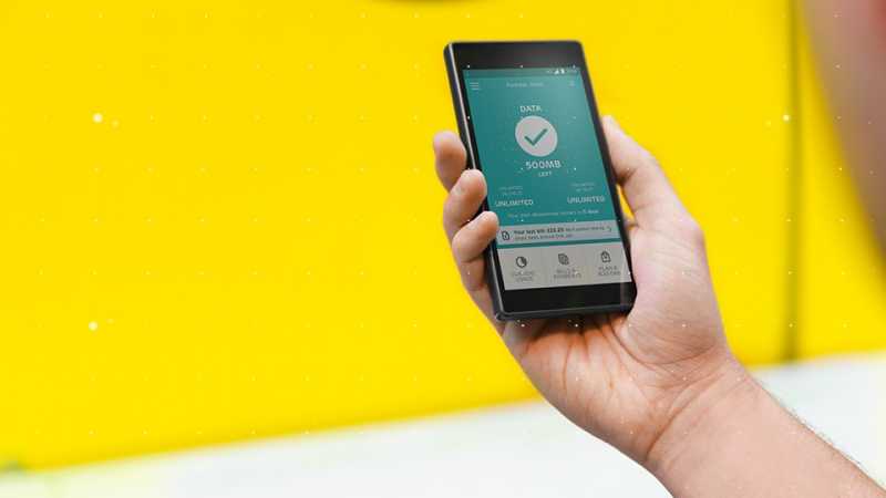 Hand holding smartphone with EE app displayed