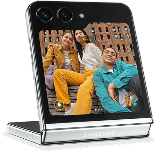 A Galaxy Z Flip5 device open in flex mode showing a group selfie on the cover screen