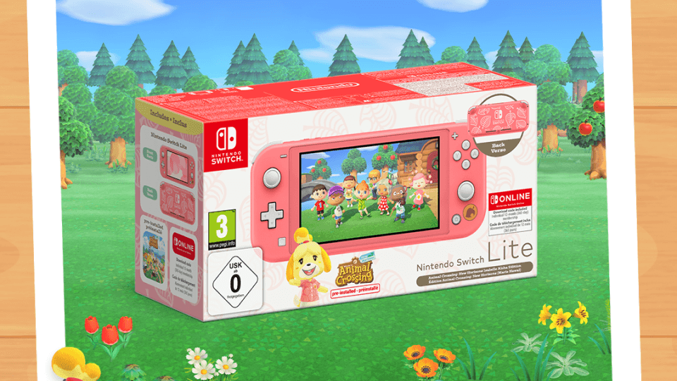 Nintendo Switch Lite Coral Edition on grass background