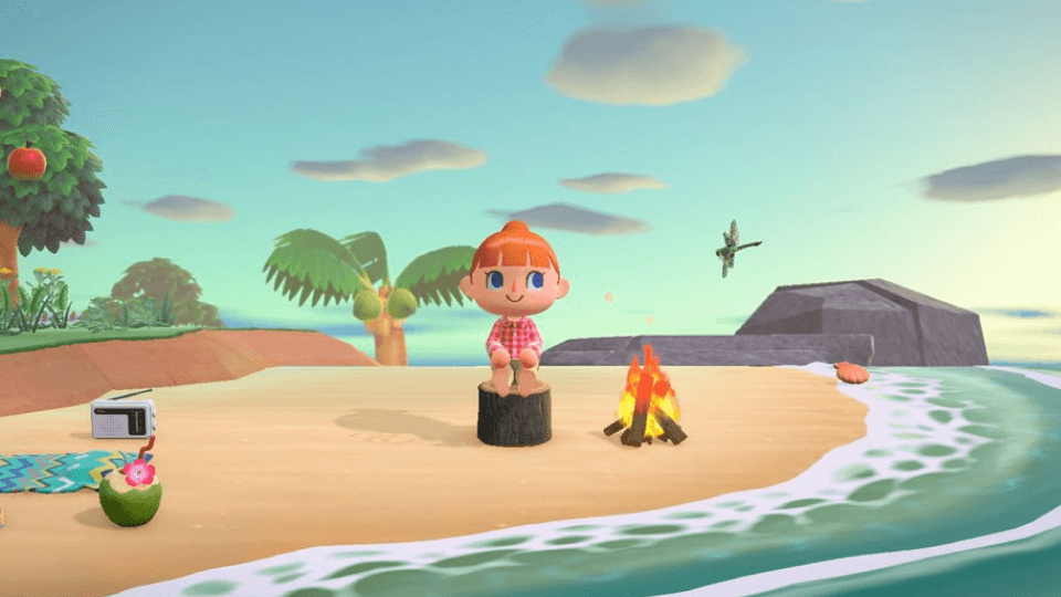 Screenshot of Animal Crossing - character sitting on a beach