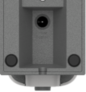 A rectangular recess with a small round socket  at one end. The power supply cable plugs into it.