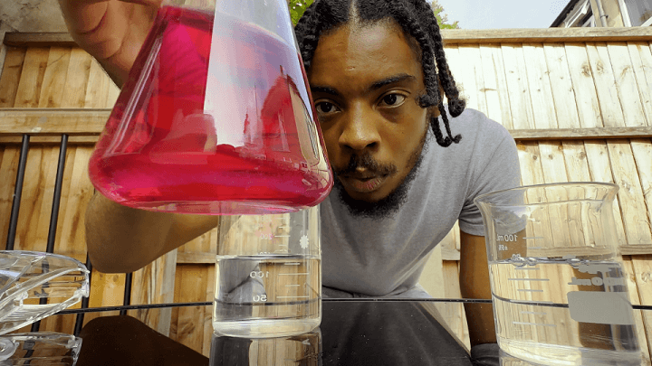 Manny Wallace performing a chemistry experiment